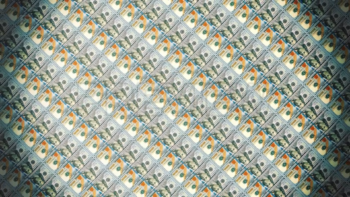 Camera Flying Over Stacked Dollar Bills