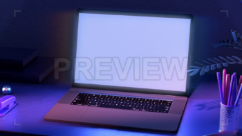Laptop On A Desk With Neon Lights
