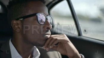 Businessman Looking Through Car Window